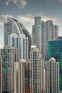 Modern buildings in city against sky