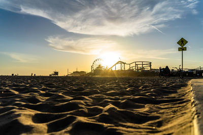 Scenic view of beach against sky during sunset