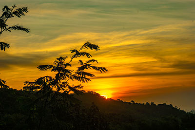 Scenic view of dramatic sky during sunrise