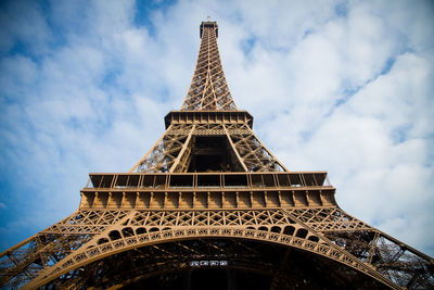 Low angle view of tower against cloudy sky