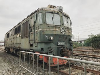 Train on railroad track against sky