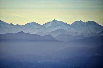 Scenic view of snowcapped mountains against sky