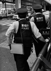 Rear view of man standing on street