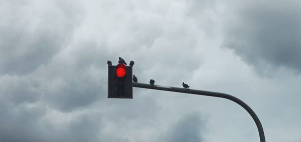 Low angle view of street light against sky