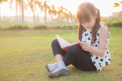 Girl sitting on grass
