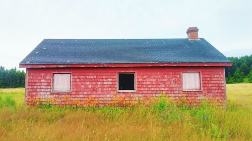 Old barn on filed against sky