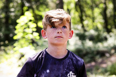 Portrait of boy in forest