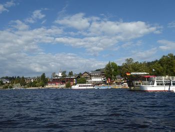 View of calm sea with buildings in background