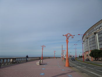 Road by sea against clear sky