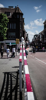 Man walking on road in city