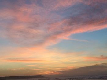 Scenic view of dramatic sky during sunset