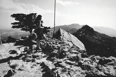 Scenic view of rocks in mountains against sky