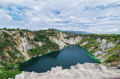 Scenic view of mountain against cloudy sky