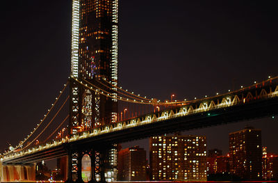 Illuminated suspension bridge at night