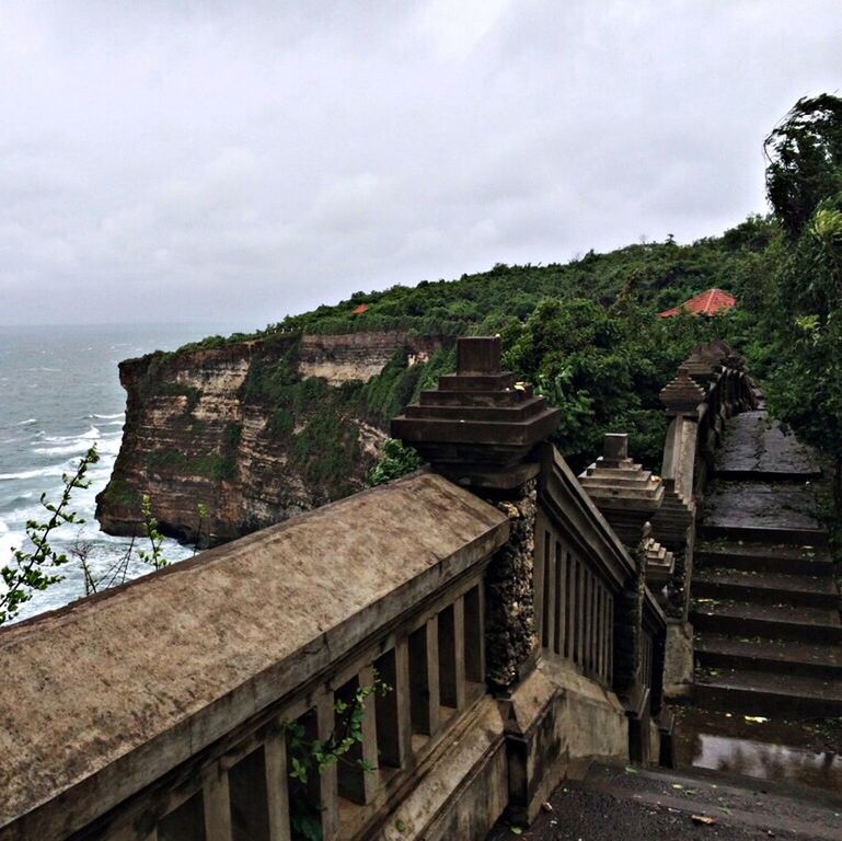 sky, sea, built structure, architecture, water, building exterior, cloud - sky, horizon over water, tree, nature, day, house, high angle view, tranquility, beauty in nature, steps, scenics, tranquil scene, outdoors, cloud