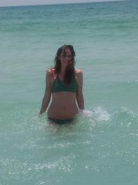 Young woman in bikini in sea