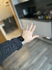 Cropped hand of woman wearing smart watch