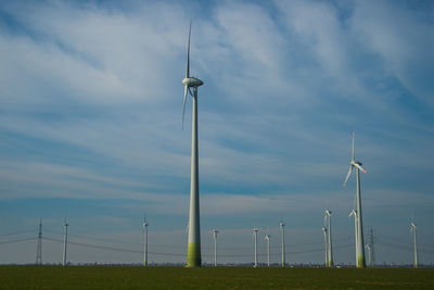 Wind turbines in field