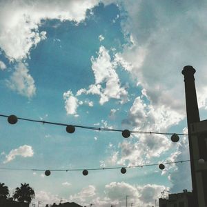 Low angle view of cables against sky