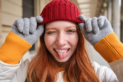 Portrait of young woman wearing knit hat