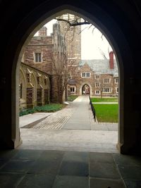 Arch bridge in front of building