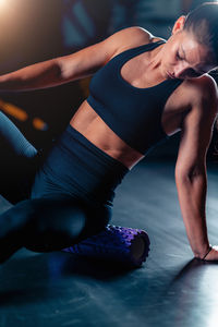 Low section of woman exercising in gym