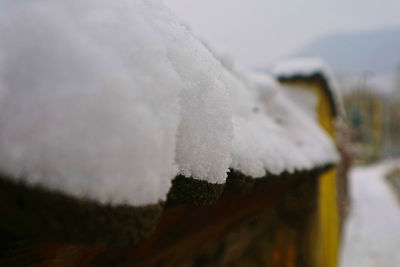 Close-up of snow against sky