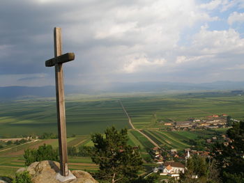 Scenic view of landscape against cloudy sky