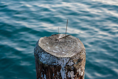 Close-up of fishing net against sea