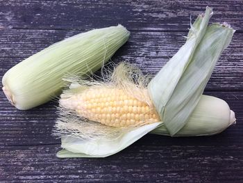 High angle view of corn on wooden table