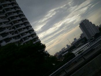 View of buildings against cloudy sky