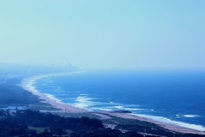 Scenic view of sea against blue sky