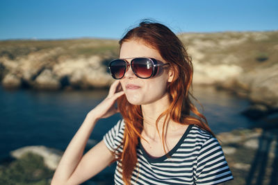 Portrait of young woman wearing sunglasses