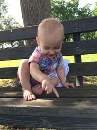 Girl sitting on wooden floor