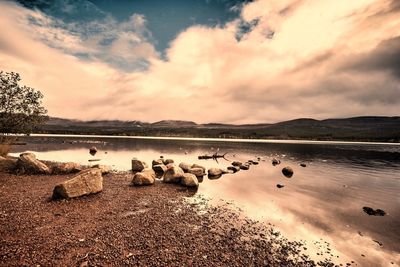 Panoramic view of lake against sky during sunset