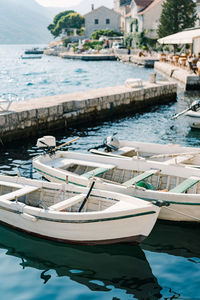 Boats moored at harbor
