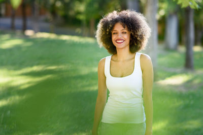 Smiling woman standing on field