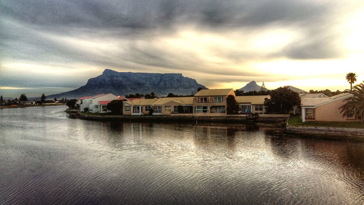 building exterior, architecture, water, built structure, sky, waterfront, cloud - sky, reflection, cloudy, house, cloud, lake, sunset, residential structure, residential building, river, weather, scenics, overcast, nature