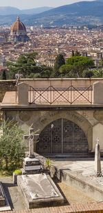 Arch bridge over buildings in city