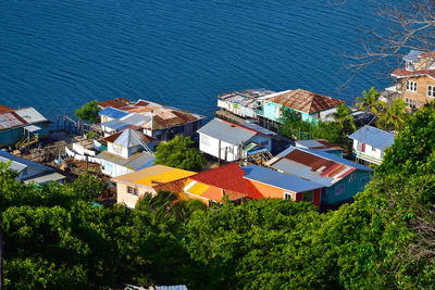 High angle view of townscape by sea