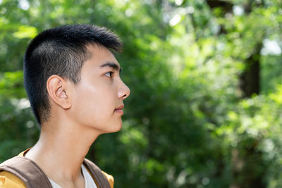 Portrait of young man looking away