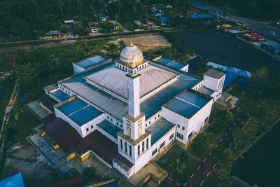 High angle view of buildings and trees in city