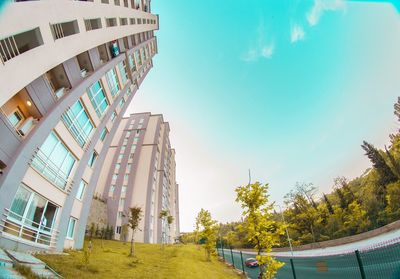 Low angle view of buildings against blue sky