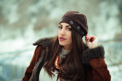 Portrait of young woman wearing warm clothes