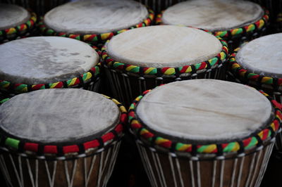 African conga drums displayed outdoors.