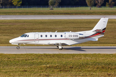 Side view of airplane on airport runway