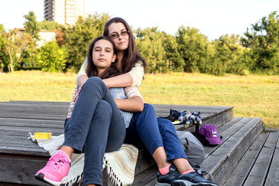 Portrait of woman sitting on bench