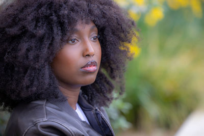 Portrait of young woman with curly hair