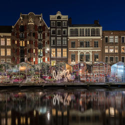 Reflection of illuminated buildings in canal at night