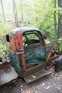 Abandoned car on country road